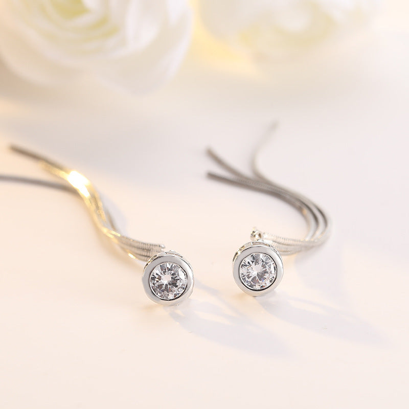 Single diamond tassel earring