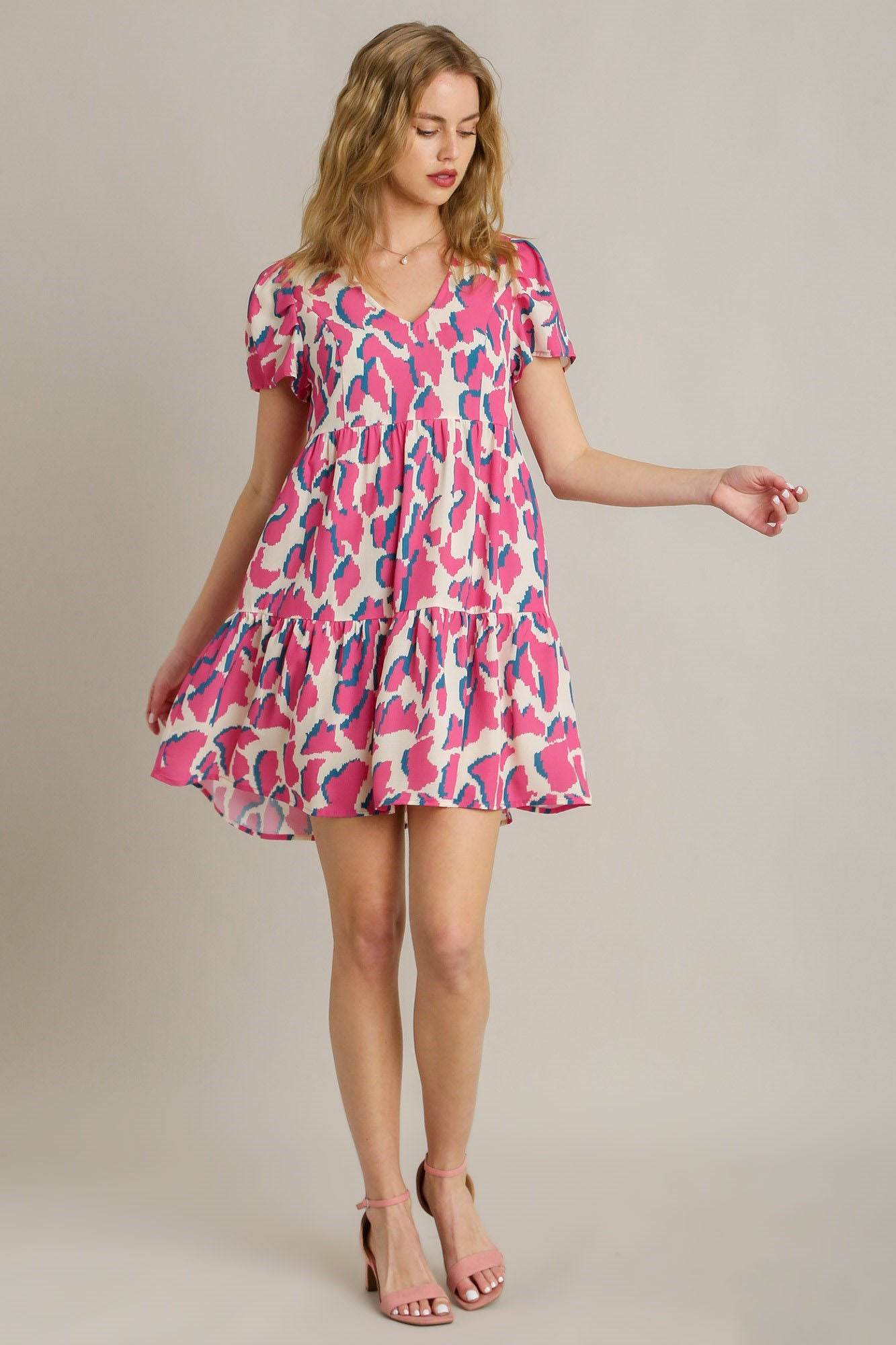 Umgee Full Size Abstract Print Pleat Detail Short Sleeve V-Neck Tiered Dress Plus Size